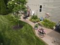This backyard features a well-kept lawn and a variety of garden decor at 4232 Parliament Way, Avon, IN 46123