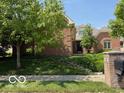 Charming brick home with mature trees and landscaping in a well-kept neighborhood at 458 Burlington Ln, Carmel, IN 46032