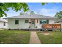 Charming one-story home featuring a landscaped yard, a cozy front porch, and inviting curb appeal at 4747 Wellington Ave, Lawrence, IN 46226