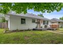 Charming one-story home featuring a landscaped yard, a cozy front porch, and inviting curb appeal at 4747 Wellington Ave, Lawrence, IN 46226