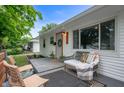 Inviting front porch with cozy seating area, perfect for enjoying the outdoors at 4747 Wellington Ave, Lawrence, IN 46226