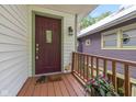 Inviting front porch with a decorative door and quaint details at 5108 Riverview Dr, Indianapolis, IN 46208