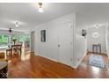Bright hallway featuring hardwood floors and an open floor plan at 5108 Riverview Dr, Indianapolis, IN 46208