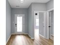 Inviting entryway with light blue walls and view to the living area at 8355 Fieldfare Way, Indianapolis, IN 46237