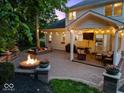 Beautiful backyard with an outdoor patio and fire pit, perfect for entertaining at 9703 Fortune Dr, Fishers, IN 46037