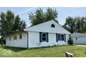Single-story home with white siding and an attached garage at 9925 Catalina Dr, Indianapolis, IN 46235