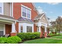 Charming exterior view highlighting manicured landscaping and the architectural details of the inviting front entrance at 15528 Bowie Dr, Westfield, IN 46074