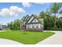 Spacious two-story house with a lush green lawn and long driveway at 16244 Perrault Ct, Fishers, IN 46040
