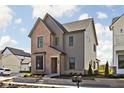 Charming home with brick and siding, lush landscaping, and convenient mailbox at 1655 Fernley Dr, Westfield, IN 46074
