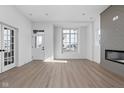 Bright and airy living room with hardwood floors, fireplace and beautiful window views at 1655 Fernley Dr, Westfield, IN 46074