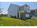 Well-maintained two-story home with brick and siding exterior and landscaped front yard at 17255 Seaboard Pl, Noblesville, IN 46060