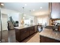 Spacious kitchen with granite countertops, stainless steel appliances, and open floor plan at 18297 Rickety Dr, Westfield, IN 46074