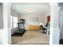 Bright office space featuring large windows, a treadmill, desk, and neutral decor at 18297 Rickety Dr, Westfield, IN 46074