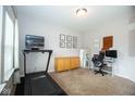 Neutral office space featuring a treadmill, desk, and modern decor at 18297 Rickety Dr, Westfield, IN 46074