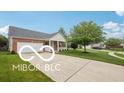 Beautiful home with attached garage, covered entry and driveway at 19146 Carol Cove Cir, Noblesville, IN 46062