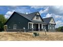Side view of the new home featuring detailed trim and well-placed windows at 1960 Delp Ct, Avon, IN 46123