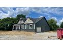 View of the new home displaying an attached garage and complementary exterior colors at 1960 Delp Ct, Avon, IN 46123