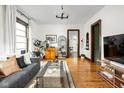 Cozy living room with hardwood floors, ample natural light, and stylish furnishings at 2158 S Garfield Dr, Indianapolis, IN 46203