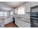 Bright kitchen with granite countertops, stainless steel appliances, and modern cabinetry at 244 W 31St St, Indianapolis, IN 46208