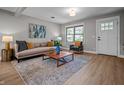 Bright living room with hardwood floors, neutral walls, and stylish furniture, creating a cozy and inviting atmosphere at 2537 N Boehning St, Indianapolis, IN 46219