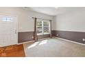 Bright living room featuring neutral paint, carpeted floors, and plenty of natural light at 3068 Reflection Ct, Greenwood, IN 46143