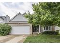 Lovely home with a brick exterior, attached garage, and lush green landscaping at 3714 Turfway Ct, Indianapolis, IN 46228