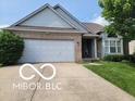 Charming single-Gathering home featuring a two-car garage and manicured lawn at 3714 Turfway Ct, Indianapolis, IN 46228