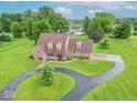 An attractive single-Gathering home on a large, lush green lot with mature trees at 505 Jones Pl, Martinsville, IN 46151