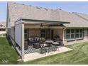 Beautiful outdoor patio area featuring a pergola, comfortable seating, and a serene backyard at 5351 Abbington Ave, Plainfield, IN 46168