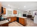 Modern kitchen boasts granite countertops, stainless steel appliances, and opens to the living area at 5625 Winston Dr, Indianapolis, IN 46226
