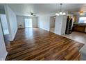 Spacious living room featuring beautiful wood floors and natural light from sliding glass doors at 581 Grassy Bend Dr, Greenwood, IN 46143