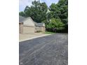 Spacious brick home with a large driveway and beautifully landscaped front yard and mature trees at 6956 Park Square Dr # D, Avon, IN 46123