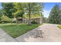 A beautiful house with a well-maintained lawn and an inviting driveway at 8712 Admirals Bay Dr, Indianapolis, IN 46236