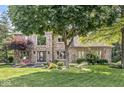 Traditional brick home featuring well-maintained landscaping and a welcoming entrance at 8712 Admirals Bay Dr, Indianapolis, IN 46236