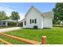 Exterior of charming home featuring a lush lawn at 89 S Grant St, Martinsville, IN 46151