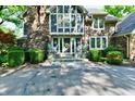 Inviting front porch with seating, tasteful decorations, and a welcoming doorway at 12380 Creekwood Ln, Carmel, IN 46032