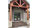Inviting front entrance featuring a covered porch with decorative wood columns and a stylish double-door entryway at 1412 10Th St, Danville, IN 46122