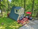 A-frame home with a spacious deck and outdoor area, ideal for lakeside relaxation and entertaining at 1413 N Lost Lake Rd, Columbus, IN 47201