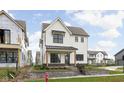 Beautiful two-story home boasting a well-manicured lawn, charming porch, and stylish design at 1654 Fernley Dr, Westfield, IN 46074
