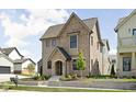 Attractive front view of this two-story home, featuring mixed brick and siding and manicured front yard at 1655 Carrollton Rail Dr, Westfield, IN 46074