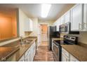 Charming kitchen with granite countertops and stainless steel appliances at 207 Keats Ct # 102, Carmel, IN 46032