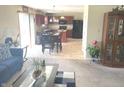 Inviting open concept living room and kitchen space with modern appliances and breakfast bar at 2253 Jaybird Dr, Greenfield, IN 46140