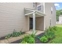 Home featuring a covered front porch with well-maintained landscaping at 2270 Collins Way, Greenfield, IN 46140