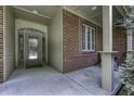 Covered front porch featuring brick accents, decorative windows, and a beautiful front door at 2553 Forest Hills Blvd, Greenwood, IN 46143