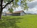 A single story home features a large backyard with room to run and play at 260 S 250 W, Greenfield, IN 46140