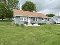 Charming single story home with a well-kept lawn and gray siding at 260 S 250 W, Greenfield, IN 46140