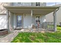 Inviting covered front porch with detailed trim and a charming entryway door at 3362 Pavetto Ln, Indianapolis, IN 46203