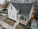 Aerial view of a two-story home with a front porch, neat landscaping, and a paved driveway at 352 W 28Th St, Indianapolis, IN 46208