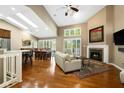 Cozy living room featuring a fireplace, skylights and an open layout at 3532 Clearwater Cir, Indianapolis, IN 46240
