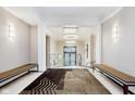 Beautifully decorated hallway with carpet and stylish ceiling with modern lighting at 355 E Ohio St # 209, Indianapolis, IN 46204